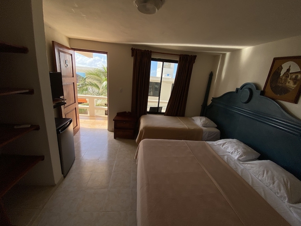 Imagen de la habitación del Hotel Chichis and Charlies Beachfront. Foto 18