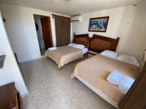 Imagen de la habitación del Hotel Chichis and Charlies Beachfront. Foto 19