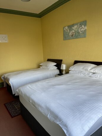 Imagen de la habitación del Hotel Chimneys Guest House. Foto 11