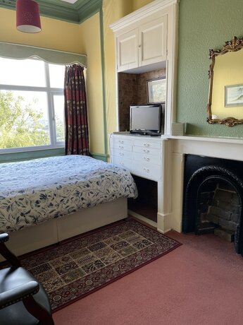 Imagen de la habitación del Hotel Chimneys Guest House. Foto 16