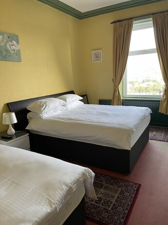 Imagen de la habitación del Hotel Chimneys Guest House. Foto 19