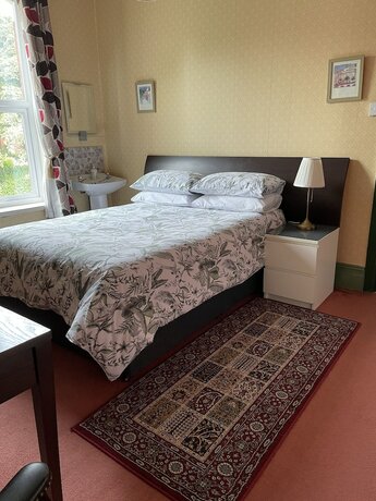 Imagen de la habitación del Hotel Chimneys Guest House. Foto 20