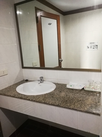 Imagen de la habitación del Hotel China Garden. Foto 11