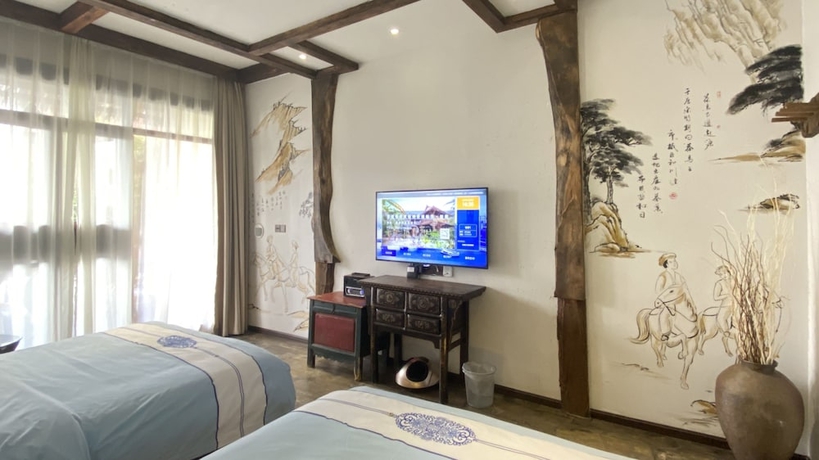 Imagen de la habitación del Hotel China Old Story Inn Lijiang Elite Garden. Foto 7