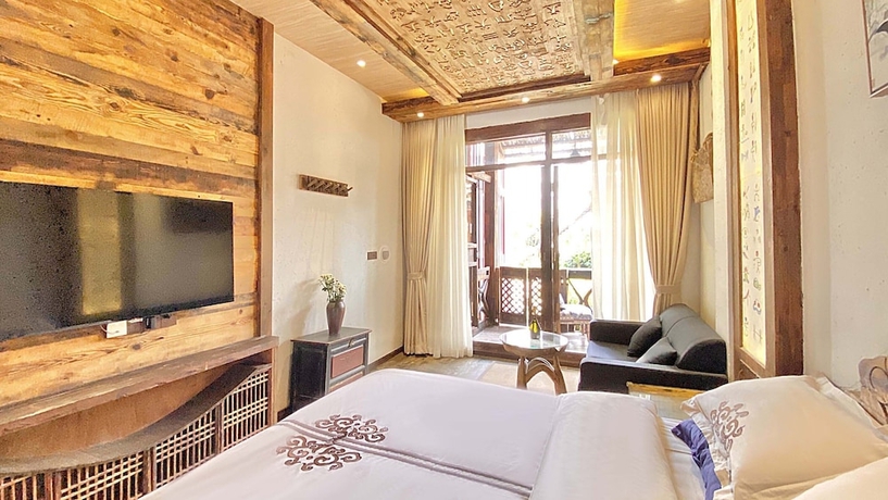 Imagen de la habitación del Hotel China Old Story Inn Lijiang Elite Garden. Foto 8