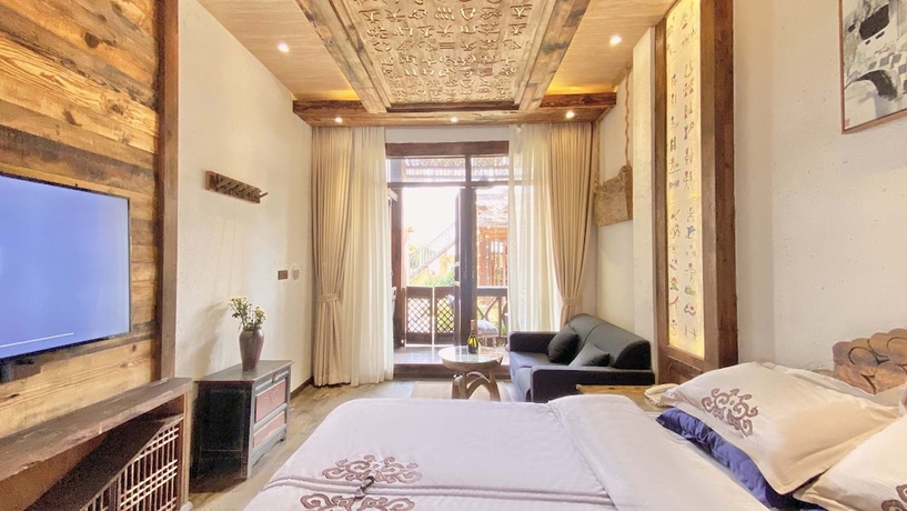 Imagen de la habitación del Hotel China Old Story Inn Lijiang Elite Garden. Foto 9