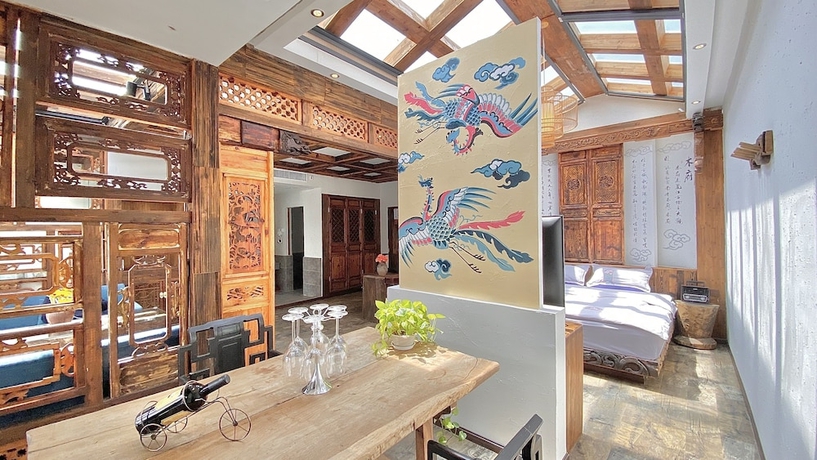 Imagen de la habitación del Hotel China Old Story Inn Lijiang Elite Garden. Foto 16