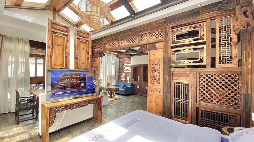 Imagen de la habitación del Hotel China Old Story Inn Lijiang Elite Garden. Foto 17