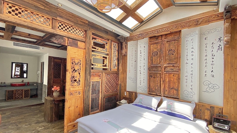 Imagen de la habitación del Hotel China Old Story Inn Lijiang Elite Garden. Foto 18