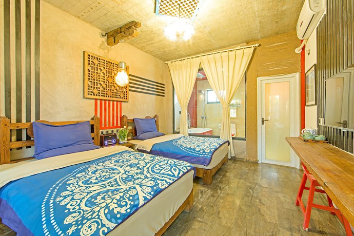 Imagen de la habitación del Hotel China Old Story Inns Dali Ancient Town. Foto 5