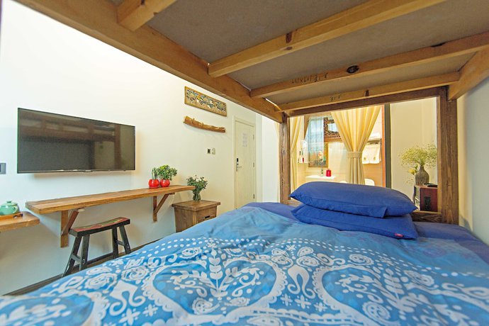 Imagen de la habitación del Hotel China Old Story Inns Dali Ancient Town. Foto 11