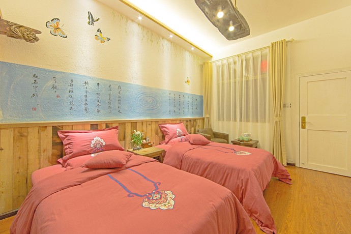 Imagen de la habitación del Hotel China Old Story Inns Dali Ancient Town. Foto 12