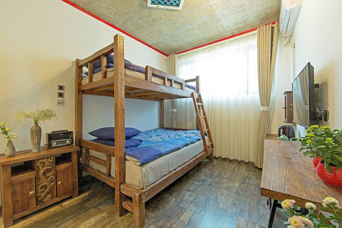 Imagen de la habitación del Hotel China Old Story Inns Dali Ancient Town. Foto 15