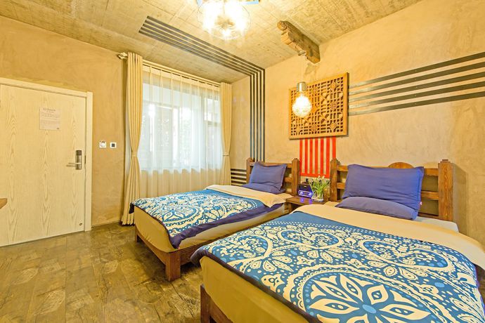 Imagen de la habitación del Hotel China Old Story Inns Dali Ancient Town. Foto 16