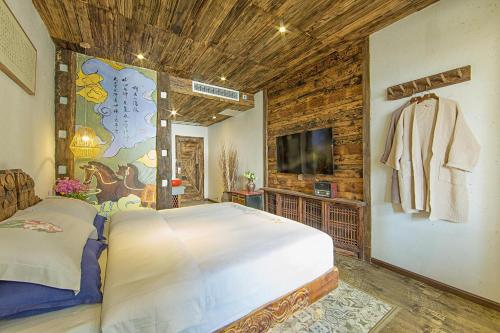 Imagen de la habitación del Hotel China Old Story Inns Encounter Lijiang. Foto 7