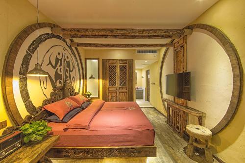 Imagen de la habitación del Hotel China Old Story Inns Encounter Lijiang. Foto 9