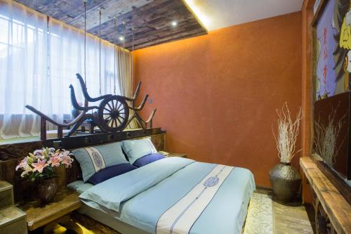 Imagen de la habitación del Hotel China Old Story Inns Lijiang Garden. Foto 8