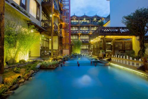 Imagen de la habitación del Hotel China Old Story Inns Lijiang Garden. Foto 10