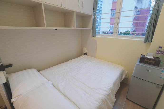 Imagen de la habitación del Hotel China Rich. Foto 16