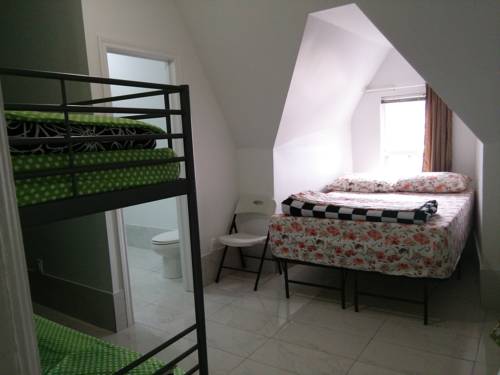 Imagen de la habitación del Hotel Chinatown Travellers Home. Foto 11