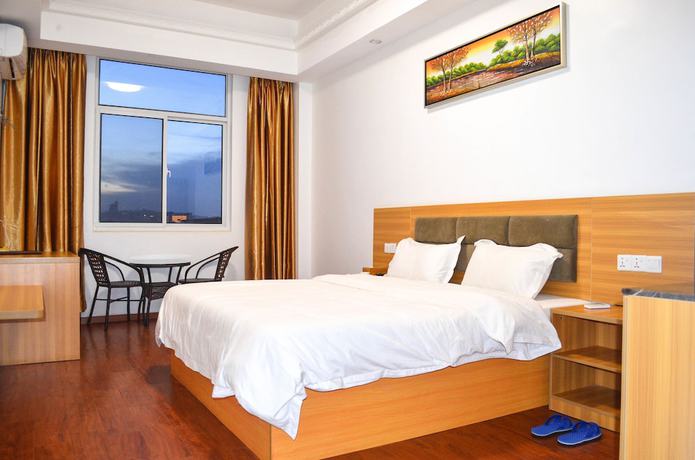 Imagen de la habitación del Hotel Chinese Business. Foto 9
