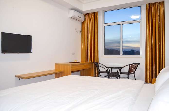 Imagen de la habitación del Hotel Chinese Business. Foto 12
