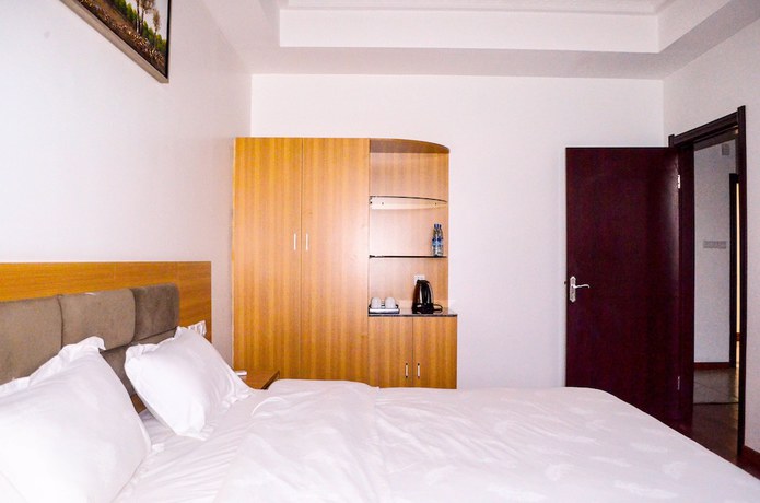 Imagen de la habitación del Hotel Chinese Business. Foto 14