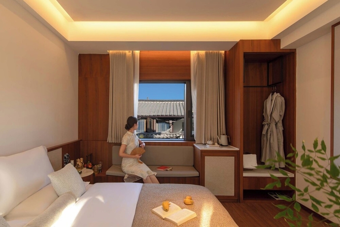 Imagen de la habitación del Hotel Chinese-style garden resort hotel. Foto 14