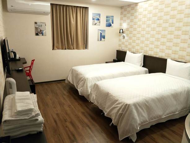 Imagen de la habitación del Hotel Ching She. Foto 10