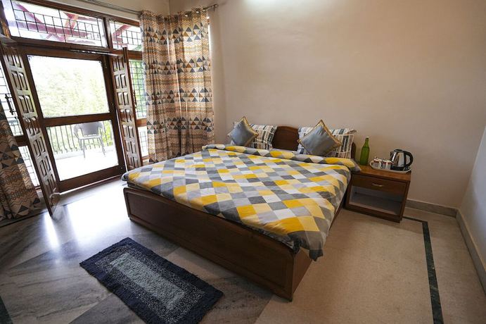 Imagen de la habitación del Hotel Chirping Hills Resort Bhimtal. Foto 11