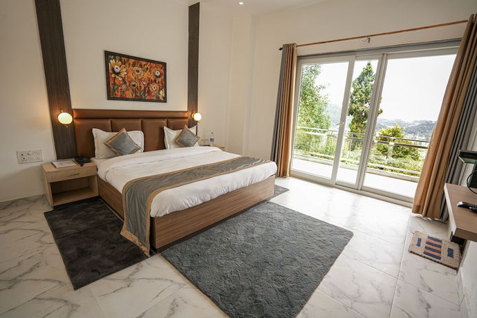 Imagen de la habitación del Hotel Chirping Hills Resort Bhimtal. Foto 14