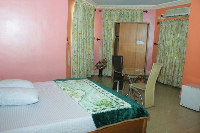 Imagen de la habitación del Hotel Chisam Suites. Foto 18