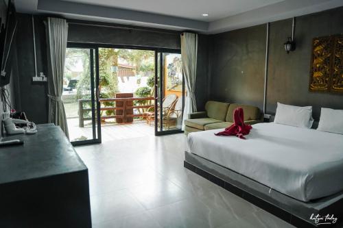 Imagen de la habitación del Hotel Chomview Lanta Water Park Resort. Foto 18