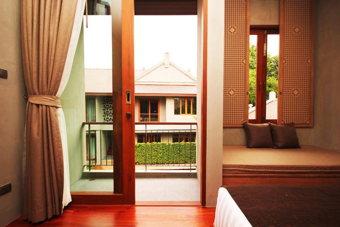 Imagen de la habitación del Hotel Chu, Chiang Mai. Foto 14