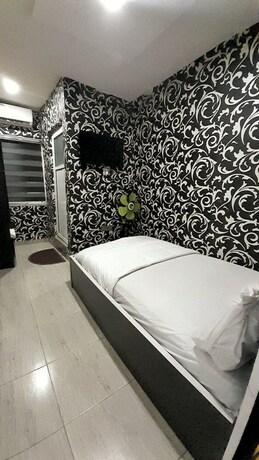 Imagen de la habitación del Hotel Chukzie Suites And Apartments. Foto 11