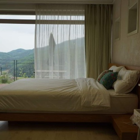 Imagen de la habitación del Hotel Chungdamhill House. Foto 17