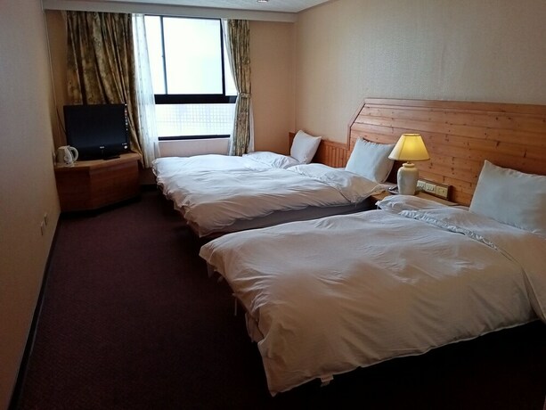 Imagen de la habitación del Hotel Chungli Business. Foto 21