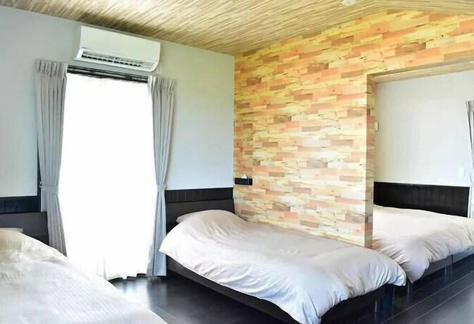 Imagen de la habitación del Hotel Churaumi Kafuu Terrace. Foto 25