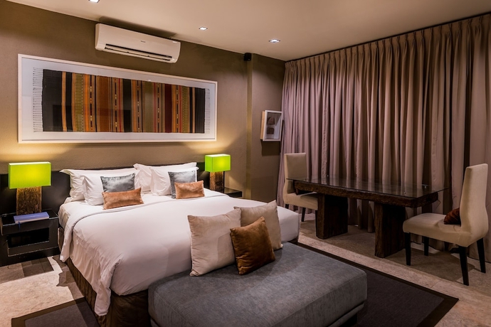 Imagen de la habitación del Hotel Cicada Luxury Townhouses. Foto 5