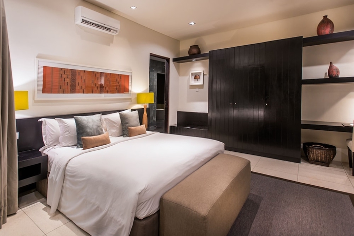 Imagen de la habitación del Hotel Cicada Luxury Townhouses. Foto 7