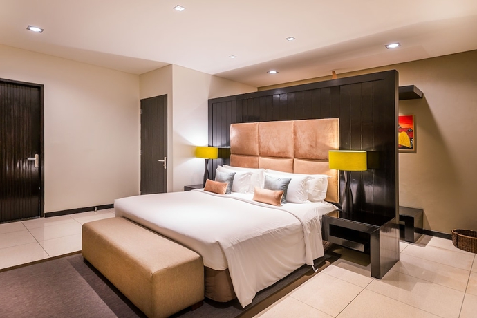 Imagen de la habitación del Hotel Cicada Luxury Townhouses. Foto 13