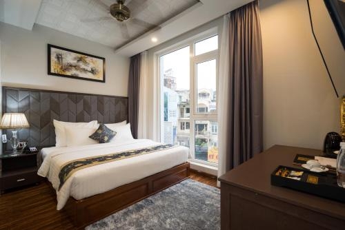 Imagen de la habitación del Hotel Cicilia City Saigon Center. Foto 7