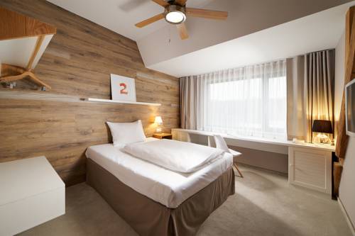 Imagen de la habitación del Hotel Cihelny Golf and Wellness Resort. Foto 11