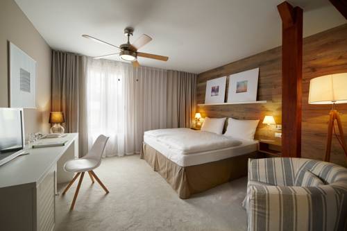 Imagen de la habitación del Hotel Cihelny Golf and Wellness Resort. Foto 17