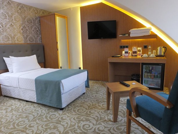 Imagen de la habitación del Hotel Cinarpark. Foto 16