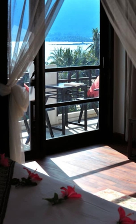 Imagen de la habitación del Hotel Cinnamon Beach Villas. Foto 9