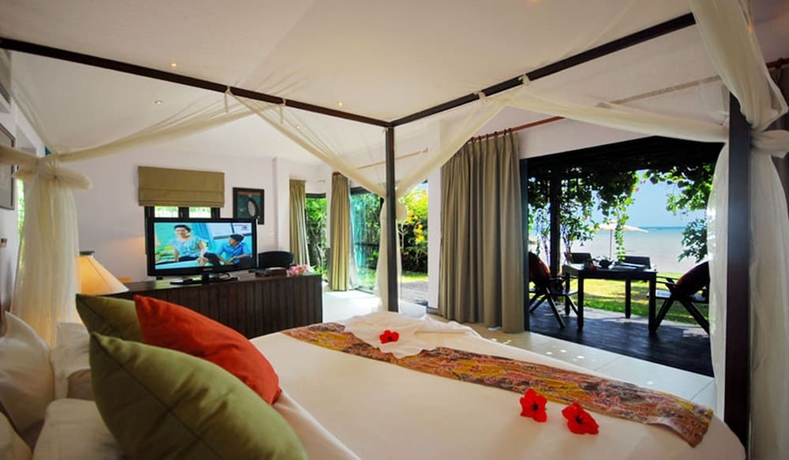 Imagen de la habitación del Hotel Cinnamon Beach Villas. Foto 10