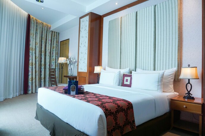 Imagen de la habitación del Hotel Cinnamon Boutique Syariah. Foto 18