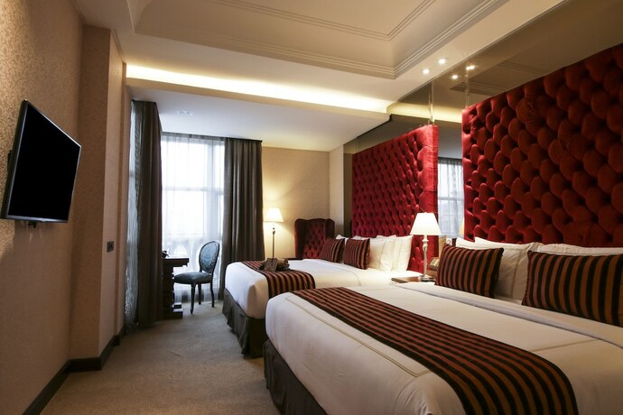 Imagen de la habitación del Hotel Cinnamon Boutique Syariah. Foto 21
