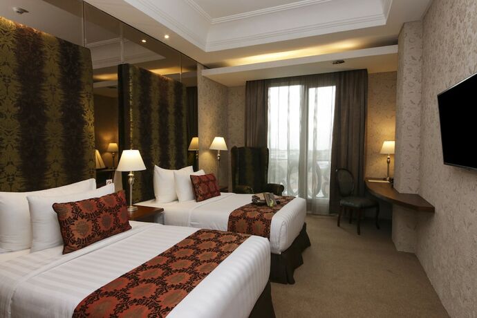 Imagen de la habitación del Hotel Cinnamon Boutique Syariah. Foto 22